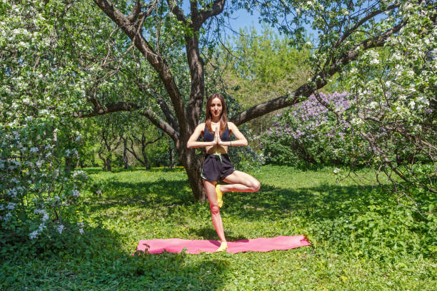 istock Young woman doing yoga exercises 960576070