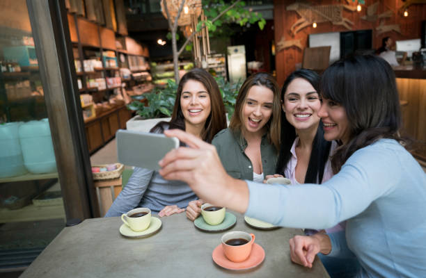 istock Happy women taking a selfie while having a cup of coffee at cafe 960576182