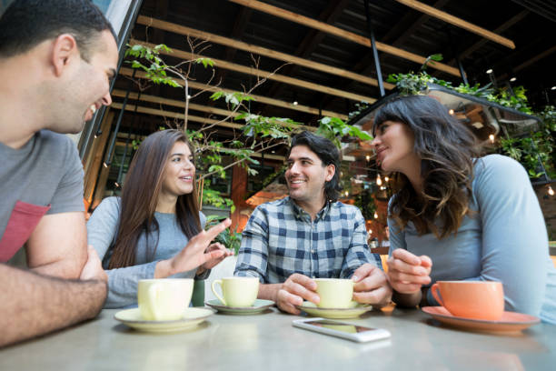 istock Friends having a cup of coffee at a cafe 960576224