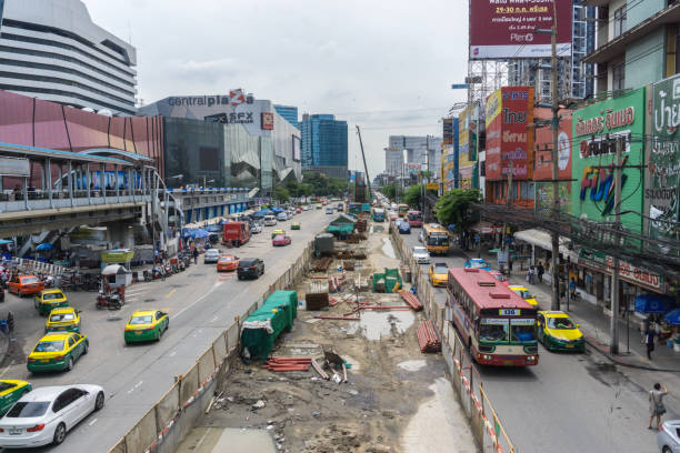 istock Bangkok, Thailand - June 15, 2017: construction site sky train station north green line front Central Plaza Ladprao and traffic jam 960579112