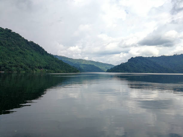 istock Blue lagoon and mountain under cloud sky., tree moutain and river in thailand. 960582616