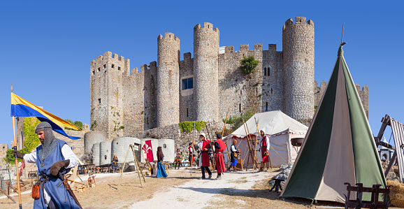 Obidos, Portugal - August 09, 2015: Obidos Castle during the Medieval Fair reenactment. Obidos is a medieval town inside walls, and very popular among tourists.