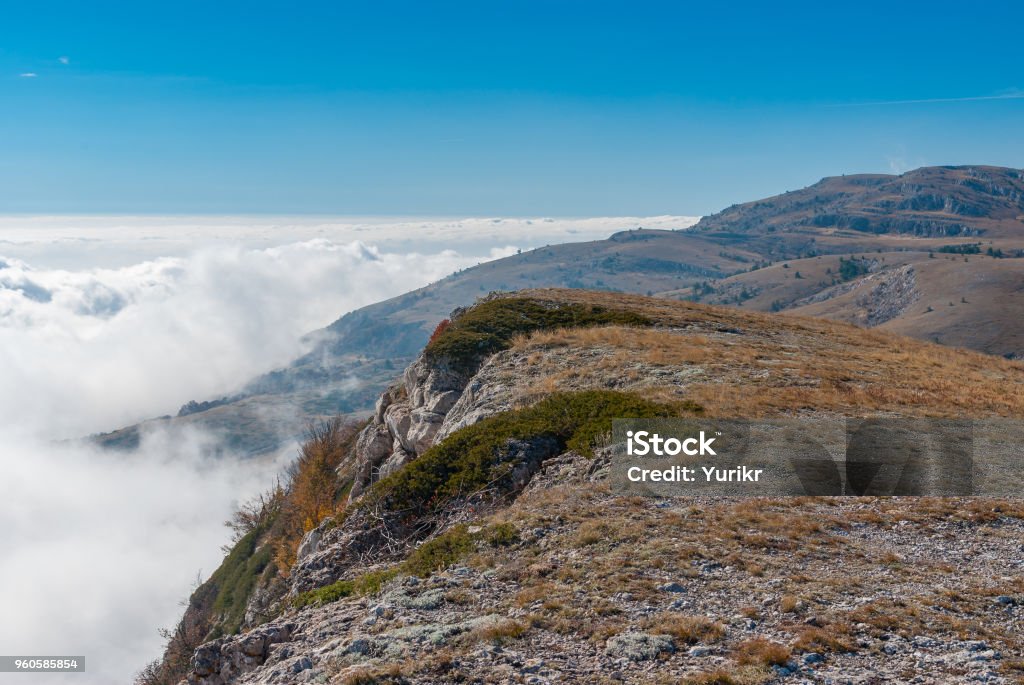 Landscape with Babuhan Yaila natural reserve with blanket of fog arisen from the Black Sea  in Crimean peninsula Autumnal landscape with Babuhan Yaila natural reserve with blanket of fog arisen from the Black Sea  in Crimean peninsula Atmospheric Mood Stock Photo