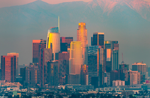 Los Angeles with red sunlight on downtown buildings.