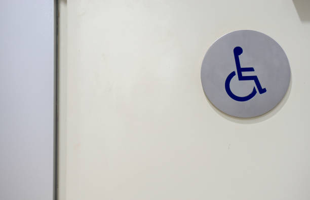 istock Disable toilet sign at a restroom door. 960586312