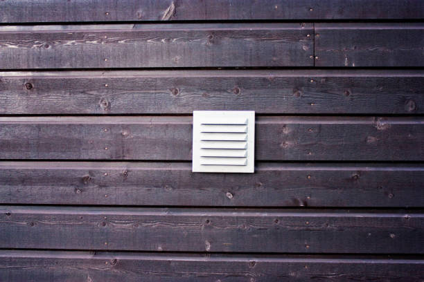 istock Red Wooden Tile Floor, Wall With Old And Rough Weathered Surface. Ventilation Slits At The Middle 960587766