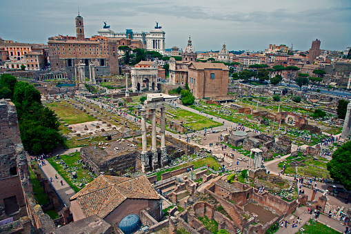 May 11, 2016: Rome, Italy: overlooking the roman forum ruins with castor and pollux pillars and gardens and city