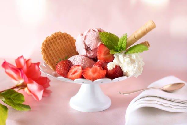 istock Ice cream cup with strawberries and cream 960591752
