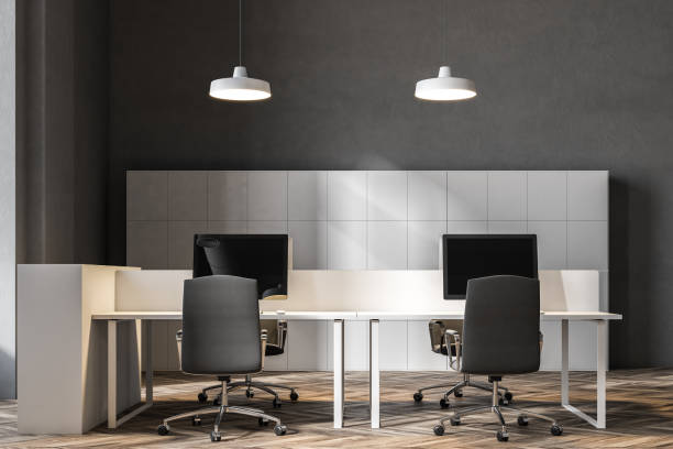 istock Front veiw of a dark gray wall office interior 960597420