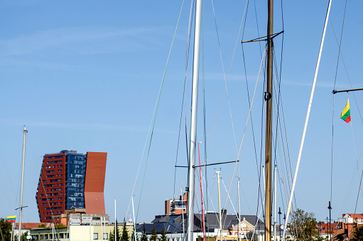 Klaipeda skyline: buildings, boats parts. Klaipeda is a coastal city in the country of Lithuania, known for being a touristic spot very popular amongst the people from that country.