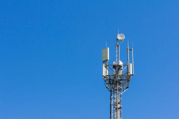 istock cell tower transmitting signals of mobile phone and Internet against the blue sky 960597782