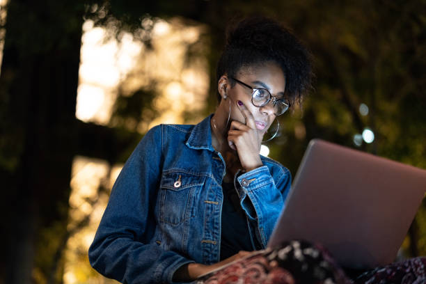Afro young woman working in her laptop
