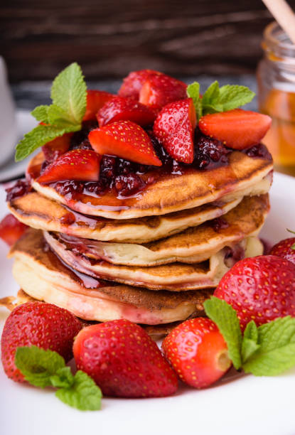 istock American pancakes with jam and fresh strawberries 960600338