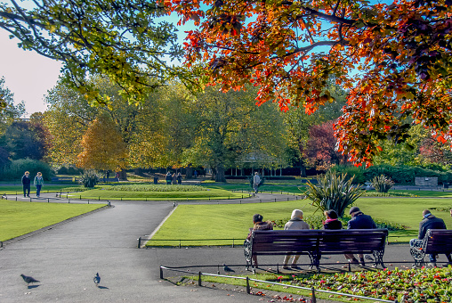 Dublin, Ireland, 27 October 2012: St Stephen's Green is a city centre public park in Dublin, Ireland. The current landscape of the park was designed by William Sheppard. It was officially re-opened to the public on Tuesday, 27 July 1880 by Lord Ardilaun.