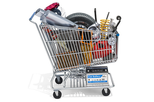 Shopping cart with car parts, 3D rendering isolated on white background