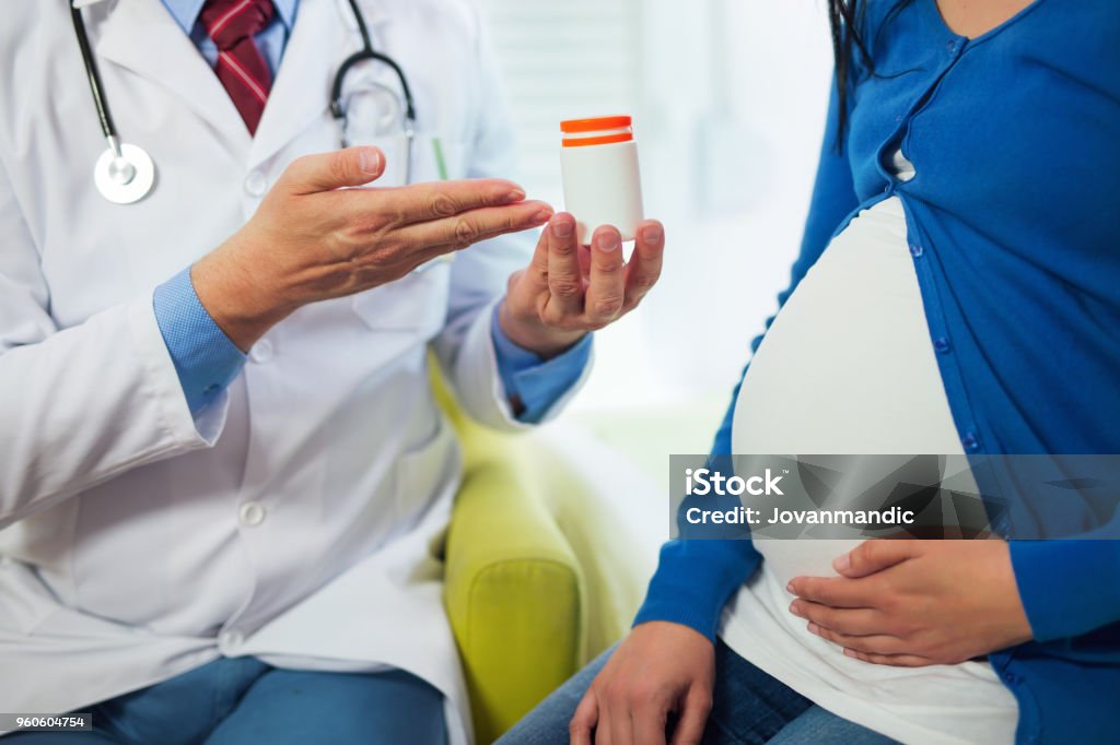 Close up of doctors who recommend vitamin to pregnant women Blood Test Stock Photo