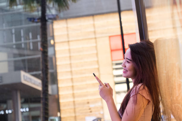 istock Asian girl using her mobile phone 960610138