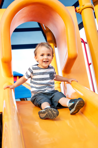 Caucasian Male toddler playing at the playground