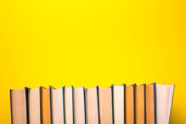 istock Books on a yellow background 960610660