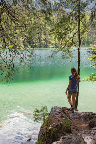 istock Women stand on a green see 960617786