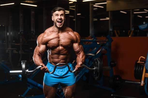 istock Handsome model muscle man abs workout in gym 960624268