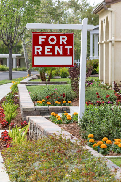 istock Red For Rent Real Estate Sign in Front House 960624856