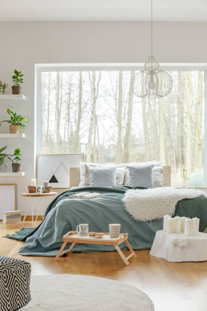 istock White and green bedroom interior 960625514