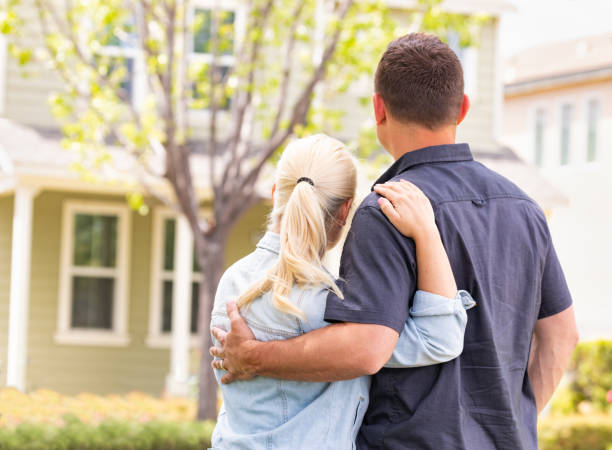 istock Happy Caucasian Couple Facing Front of House 960627780