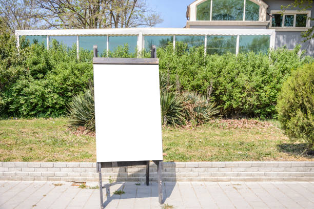 istock blank blackboard on the street with place for text. 960630440