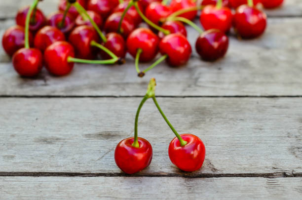 istock Fresh ripe cherries on wooden table 960630812
