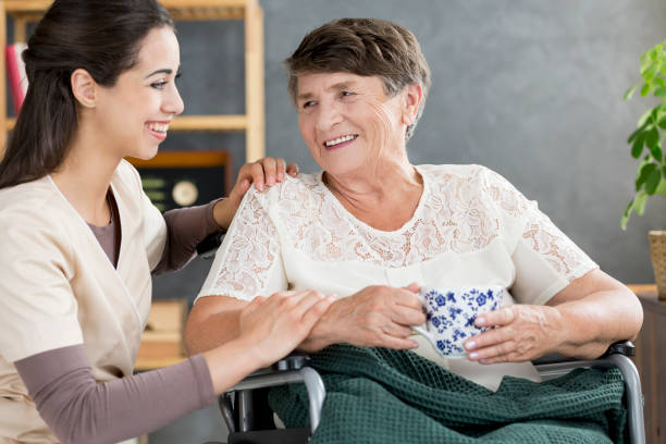 istock Caregiver talking to pensioner 960631098