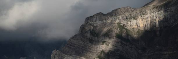 istock Mountainside Detail And Clouds 960642098