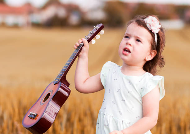 istock a young guitar player in the wheat field 960644574