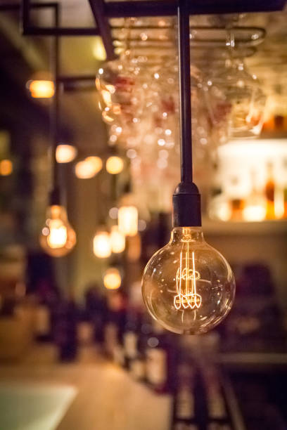 istock Vintage lamp bulb with bar or cafe night abstract background 960644588