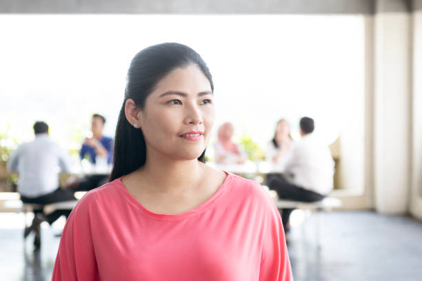 Mature businesswoman looking away with pensive expression