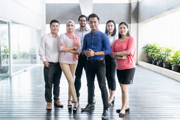 istock Mixed age range business colleagues in modern office 960645216