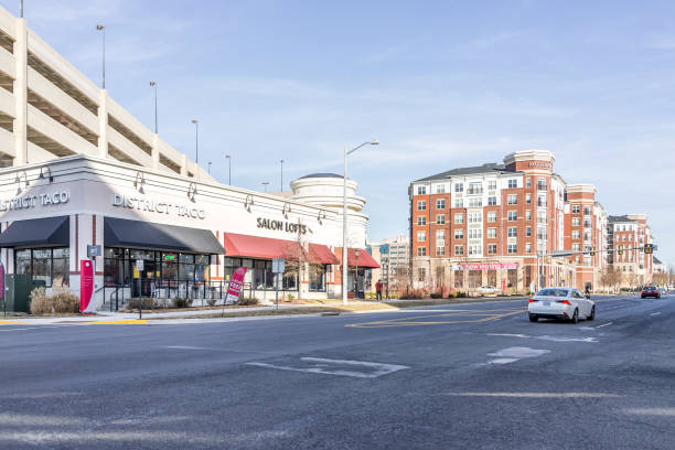 Prosperity Avenue Virginia road in Merrifield neighborhood of county by Dunn Loring Metro, Falls Church, with Modera apartments, district taco, salon lofts Fairfax, USA - January 26, 2018: Prosperity Avenue Virginia road in Merrifield neighborhood of county by Dunn Loring Metro, Falls Church, with Modera apartments, district taco, salon lofts fairfax virginia photos stock pictures, royalty-free photos & images