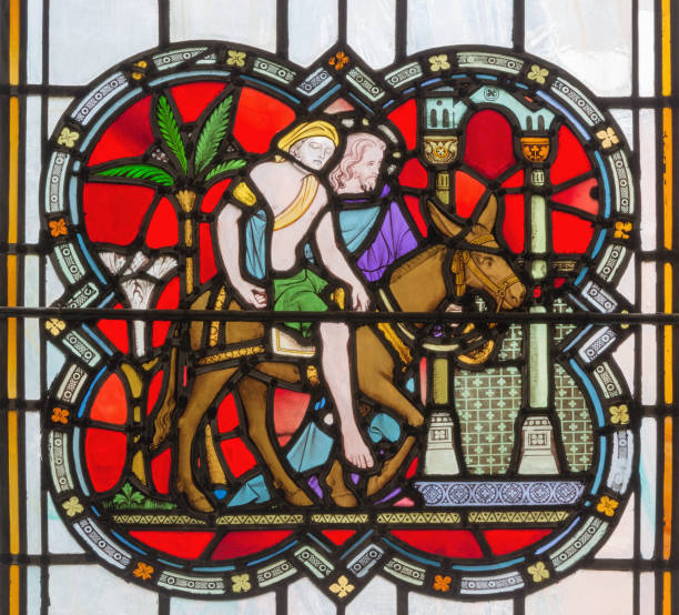 london - the parable of the good samaritan on the stained glass - good samaritan imagens e fotografias de stock