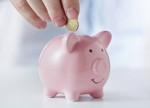 istock coin into piggy-bank 960655952
