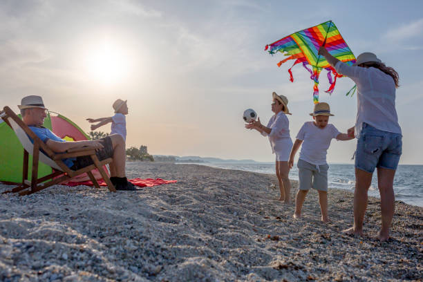 Multi generation family having fun at the beach