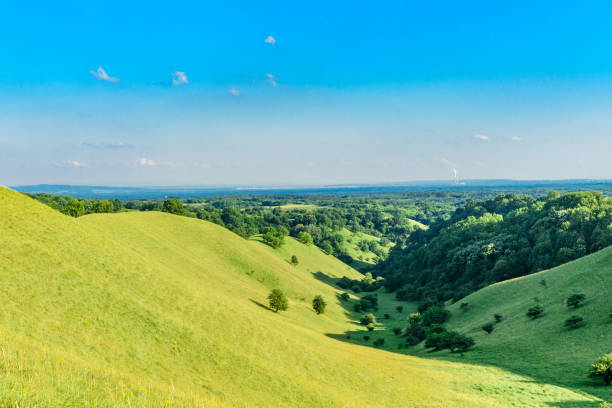 istock Green hills and the clouds 960659544
