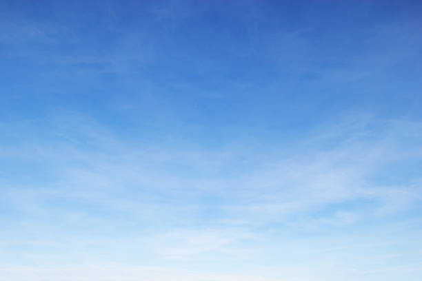 istock Soft white clouds against blue sky background and empty space for your design 960665502