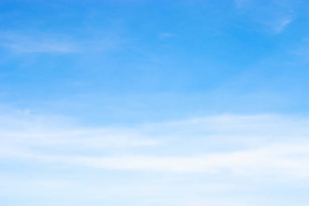 istock Soft white clouds against blue sky background and empty space for your design 960665782