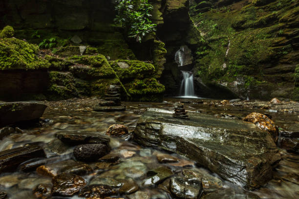 istock Waterfall and stone stacks in faerie glen, Cornwall, England 960665866