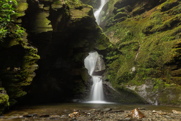 istock Waterfall and stone stacks in faerie glen, Cornwall, England 960665890