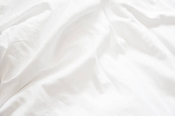 istock Close up of white bedding sheets soft focus and copy space 960665978