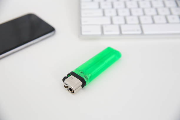 Close-up of a green lighter on the table