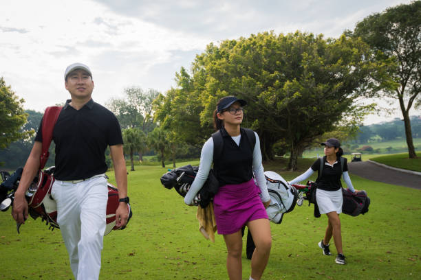 istock Team of golfers walking to the next hole 960669740