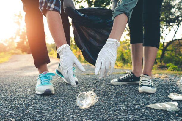 istock Women volunteer help garbage collection charity environment. 960679964