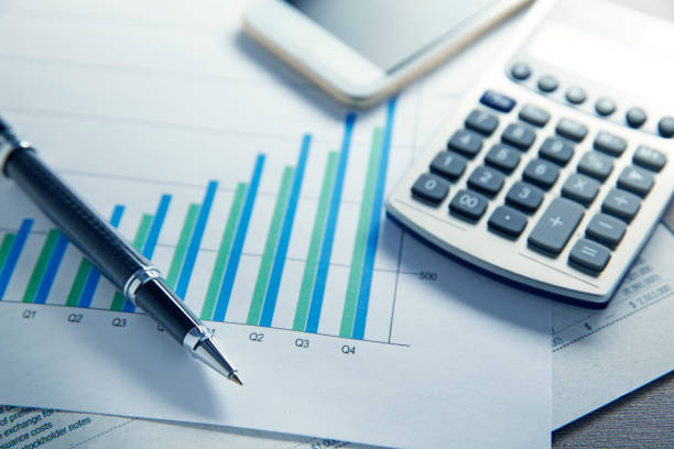 financial reports and bar graph - bar graph imagens e fotografias de stock